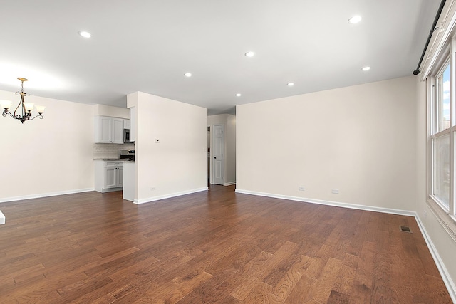 2725 Weeping Willow Dr Unit D, Lisle, IL 60532 - unfurnished living room with a chandelier, dark wood finished floors, and recessed lighting