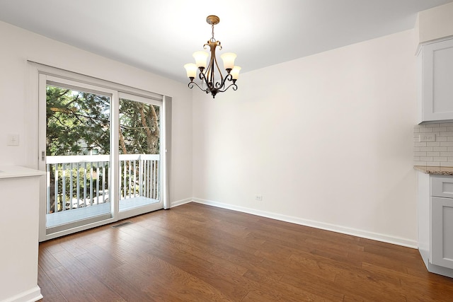 2725 Weeping Willow Dr Unit D, Lisle, IL 60532 - unfurnished dining area featuring dark wood-style flooring and a chandelier