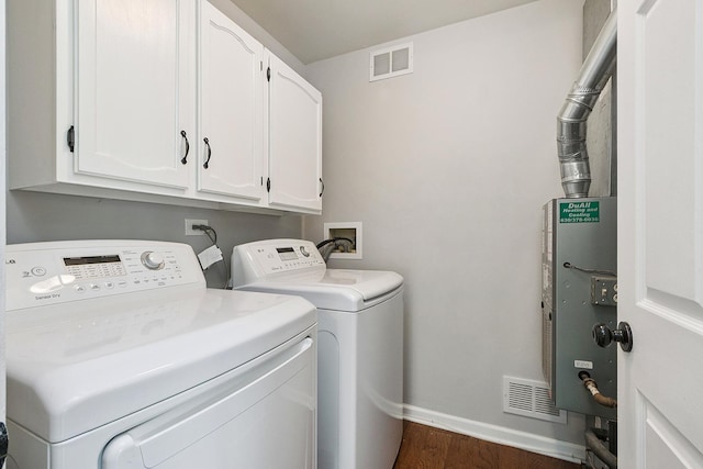 2725 Weeping Willow Dr Unit D, Lisle, IL 60532 - washroom featuring washing machine and dryer, cabinet space, and dark wood-style floors