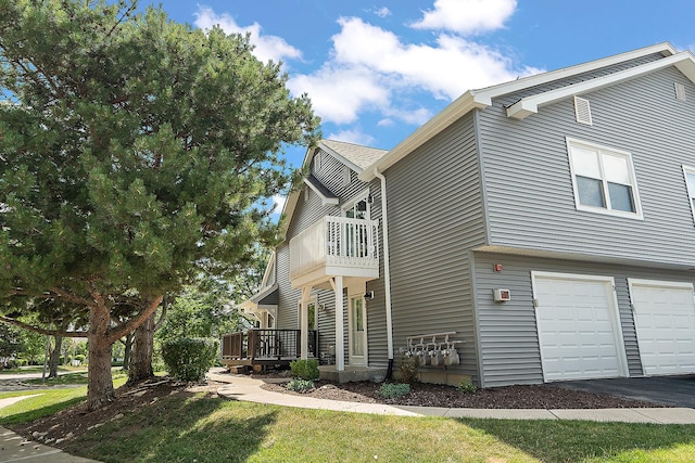 2725 Weeping Willow Dr Unit D, Lisle, IL 60532 - view of side of home with a garage, a balcony, asphalt driveway, and a deck