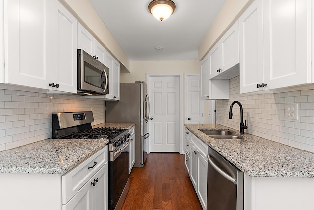 2725 Weeping Willow Dr Unit D, Lisle, IL 60532 - kitchen featuring stainless steel appliances, decorative backsplash, white cabinetry, and dark wood-type flooring