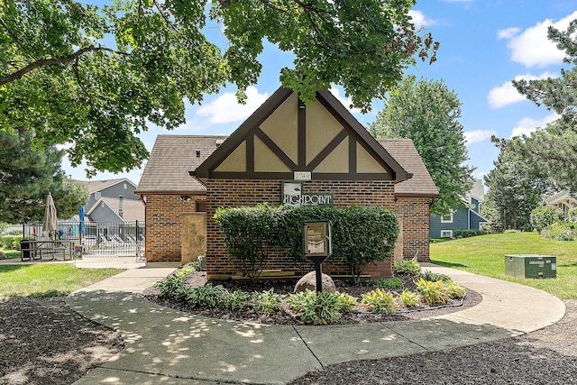 2725 Weeping Willow Dr Unit D, Lisle, IL 60532 - view of property exterior featuring brick siding and a shingled roof