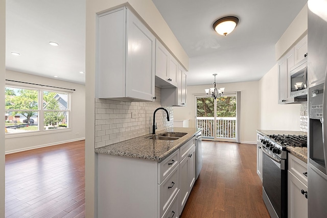 2725 Weeping Willow Dr Unit D, Lisle, IL 60532 - kitchen with appliances with stainless steel finishes, plenty of natural light, a chandelier, dark wood finished floors, and recessed lighting