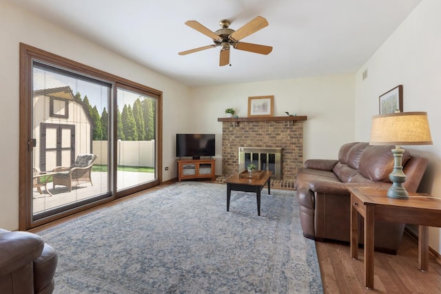 588 Montego Dr, Elk Grove Village, IL 60007 - living area featuring wood finished floors, ceiling fan, and a fireplace