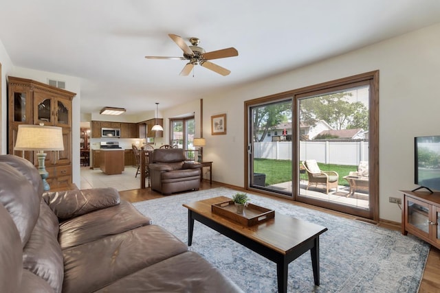 588 Montego Dr, Elk Grove Village, IL 60007 - living room featuring a ceiling fan and light wood-type flooring