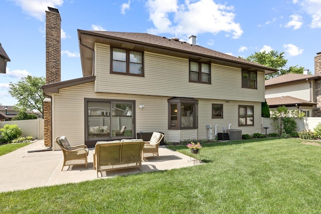 588 Montego Dr, Elk Grove Village, IL 60007 - rear view of property with a chimney, a patio area, and outdoor lounge area