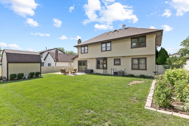 588 Montego Dr, Elk Grove Village, IL 60007 - rear view of house featuring a patio area, a storage unit, an outdoor living space, a fenced backyard, and a chimney