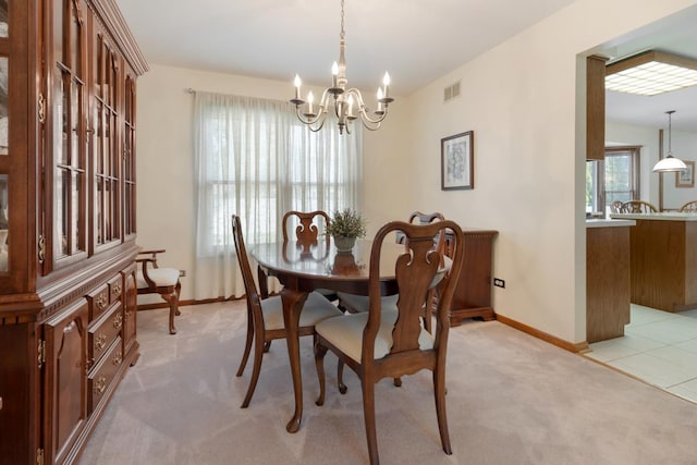 588 Montego Dr, Elk Grove Village, IL 60007 - dining area featuring light carpet and a chandelier