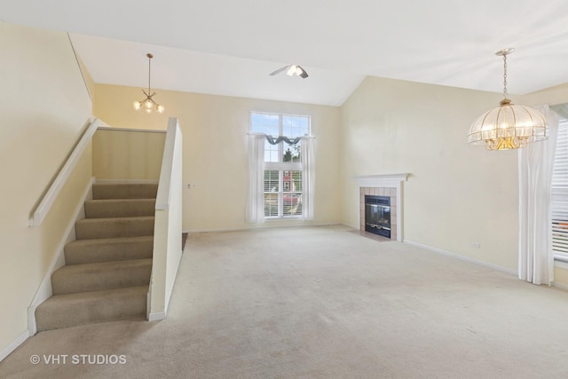 3087 Clifton Ct, Aurora, IL 60504 - unfurnished living room featuring a chandelier, carpet, stairway, and lofted ceiling