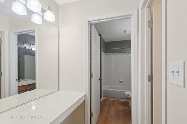 3087 Clifton Ct, Aurora, IL 60504 - full bathroom featuring washtub / shower combination, wood finished floors, and vanity