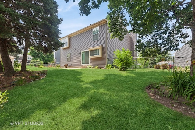 3087 Clifton Ct, Aurora, IL 60504 - back of house with a chimney