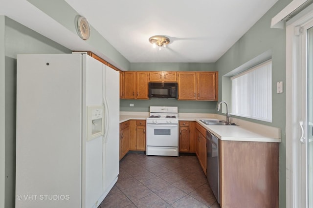 3087 Clifton Ct, Aurora, IL 60504 - kitchen featuring white appliances, light countertops, tile patterned floors, and brown cabinetry