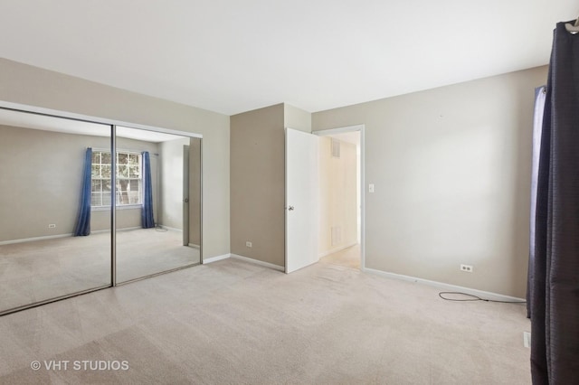 3087 Clifton Ct, Aurora, IL 60504 - unfurnished bedroom featuring light carpet and a closet