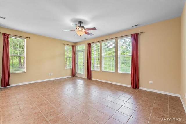 16 Christie Ct Unit 16, Algonquin, IL 60102 - empty room with light tile patterned floors, healthy amount of natural light, and a ceiling fan