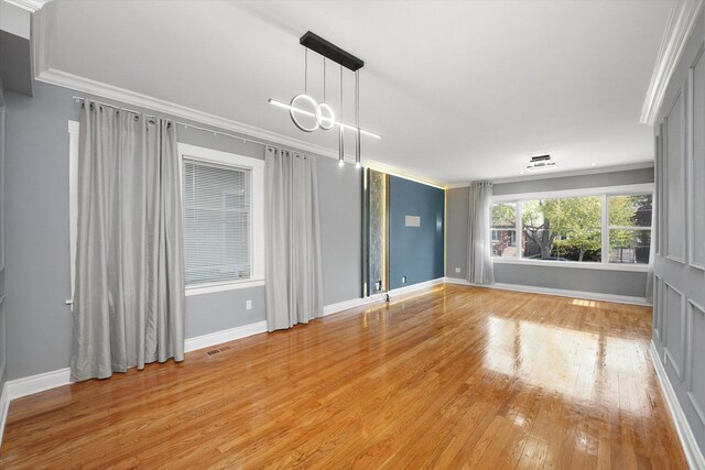 5151 W Fletcher St, Chicago, IL 60641 - empty room featuring ornamental molding and light wood-type flooring