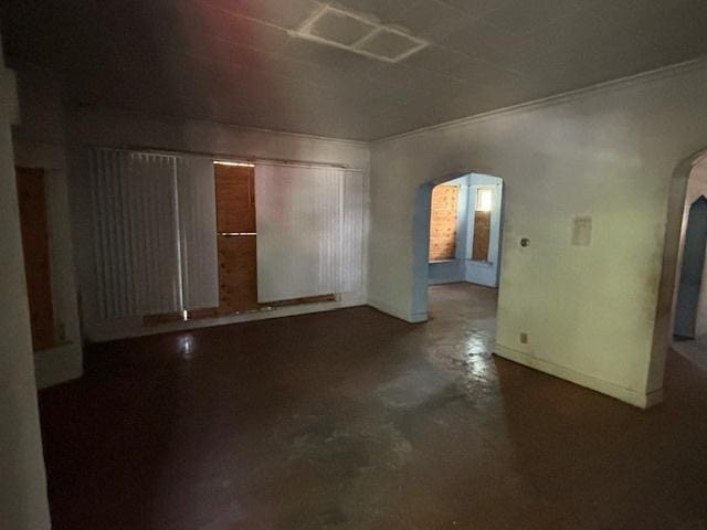 10230 S Union Ave, Chicago, IL 60628 - empty room featuring arched walkways, concrete flooring, and crown molding