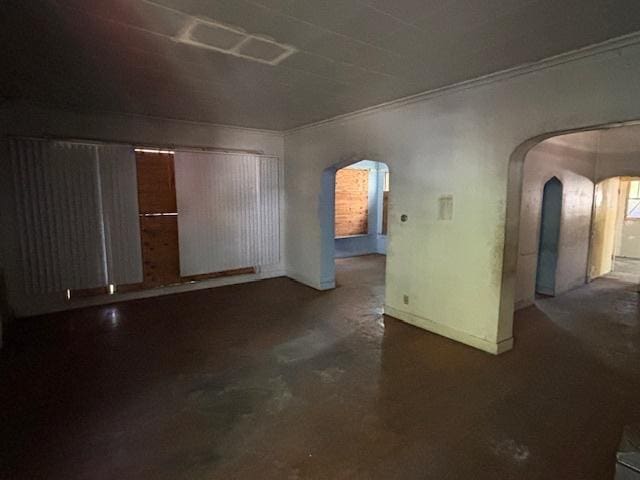 10230 S Union Ave, Chicago, IL 60628 - unfurnished room with arched walkways, ornamental molding, and concrete flooring