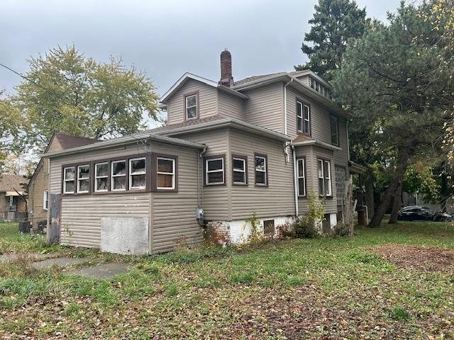 10230 S Union Ave, Chicago, IL 60628 - view of side of home featuring a chimney