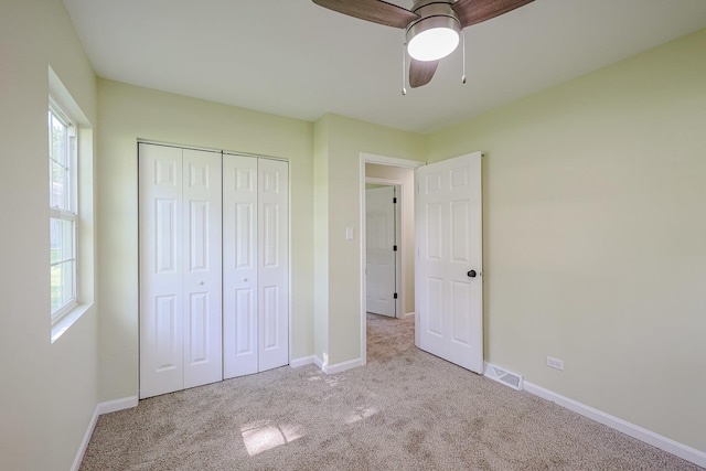 413 Channel Dr, Island Lake, IL 60042 - unfurnished bedroom with carpet floors, a closet, and a ceiling fan