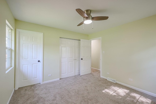 413 Channel Dr, Island Lake, IL 60042 - unfurnished bedroom with carpet flooring, a closet, and a ceiling fan