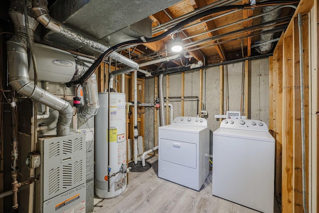 413 Channel Dr, Island Lake, IL 60042 - unfinished below grade area with gas water heater, washing machine and clothes dryer, and light wood-style floors