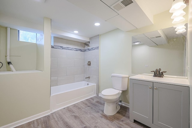 413 Channel Dr, Island Lake, IL 60042 - bathroom with vanity, wood finished floors, shower / bathtub combination, and recessed lighting