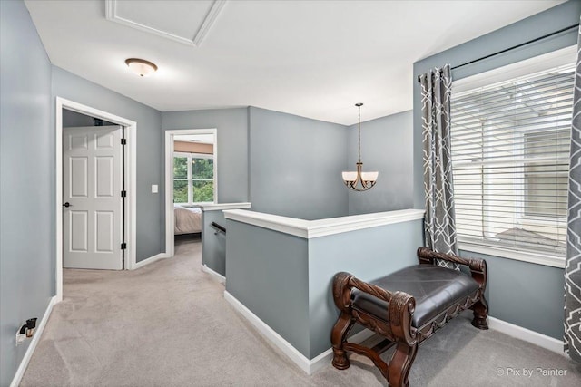 9196 Falcon Greens Dr, Lakewood, IL 60014 - hallway with light colored carpet, an upstairs landing, and a chandelier