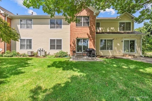 9196 Falcon Greens Dr, Lakewood, IL 60014 - back of property featuring a patio and a yard