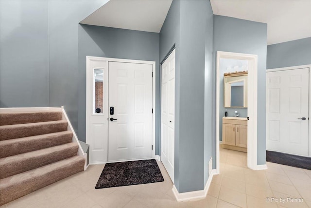 9196 Falcon Greens Dr, Lakewood, IL 60014 - foyer entrance featuring light tile patterned floors and stairway