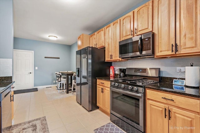 9196 Falcon Greens Dr, Lakewood, IL 60014 - kitchen featuring appliances with stainless steel finishes, backsplash, dark stone countertops, and light brown cabinets