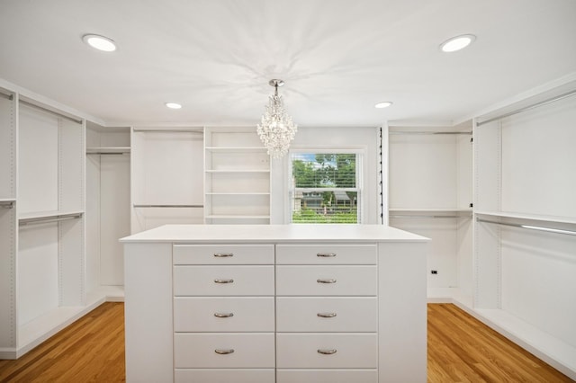2425 N Drury Ln, Arlington Heights, IL 60004 - walk in closet featuring light wood-style flooring and a chandelier