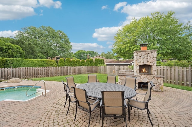 2425 N Drury Ln, Arlington Heights, IL 60004 - fenced backyard featuring an outdoor stone fireplace, a patio area, and outdoor dining space