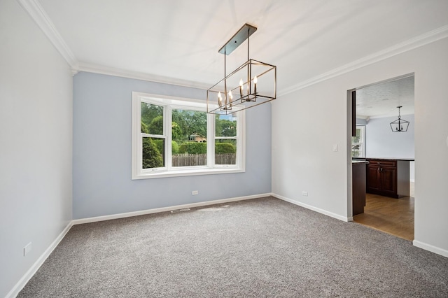 2425 N Drury Ln, Arlington Heights, IL 60004 - empty room with carpet, plenty of natural light, ornamental molding, and a chandelier