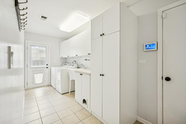 2425 N Drury Ln, Arlington Heights, IL 60004 - laundry area featuring cabinet space, independent washer and dryer, and light tile patterned flooring