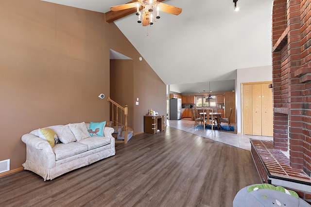 8542 Monaghan Dr, Tinley Park, IL 60487 - living room featuring ceiling fan, high vaulted ceiling, stairway, wood finished floors, and beam ceiling