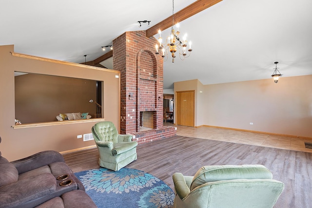 8542 Monaghan Dr, Tinley Park, IL 60487 - living room with a chandelier, wood finished floors, and a brick fireplace