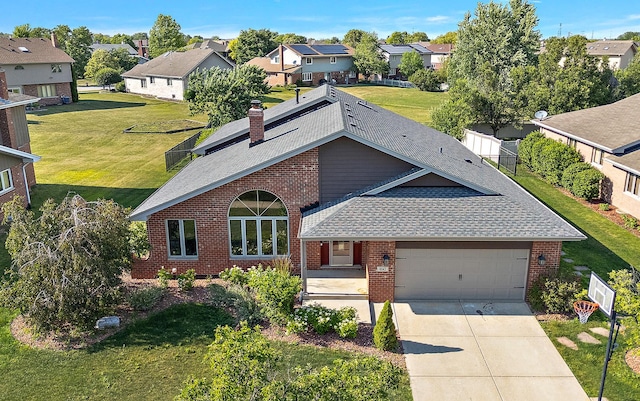 8542 Monaghan Dr, Tinley Park, IL 60487 - view of front of home featuring a shingled roof, a residential view, brick siding, and an attached garage