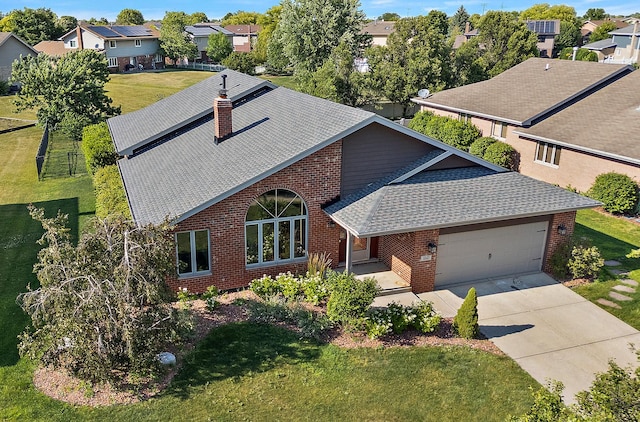8542 Monaghan Dr, Tinley Park, IL 60487 - view of front of property featuring brick siding, a shingled roof, a chimney, an attached garage, and driveway