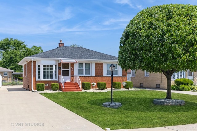205 W 29th Pl S, Chicago Heights, IL 60411 - bungalow-style house featuring brick siding, a front yard, a chimney, and roof with shingles