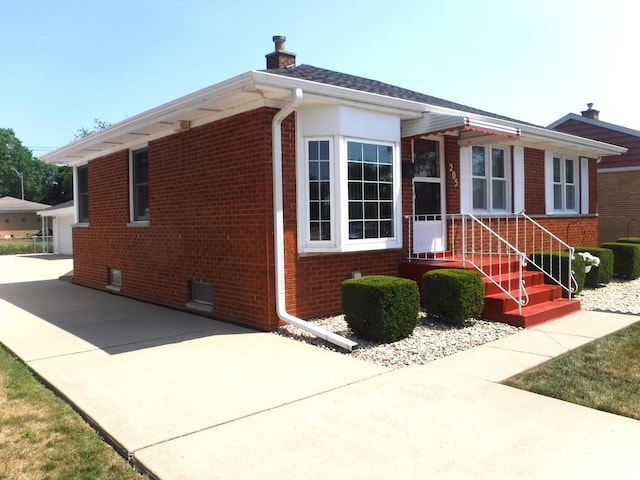 205 W 29th Pl S, Chicago Heights, IL 60411 - view of front of home featuring brick siding and a chimney