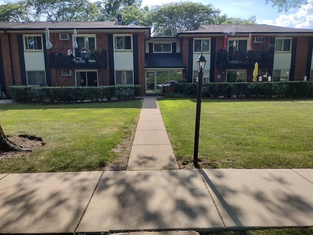 1202 N Dale Ave Unit 2L, Arlington Heights, IL 60004 - view of front facade with brick siding and a front yard