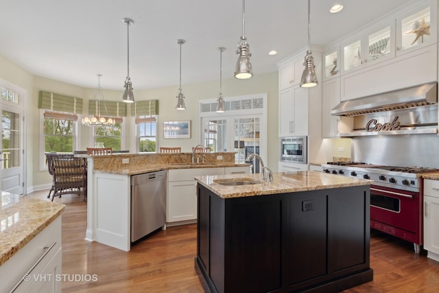 6531 W Cedar Ct, Monee, IL 60449 - kitchen with appliances with stainless steel finishes, a center island with sink, exhaust hood, dark wood finished floors, and recessed lighting