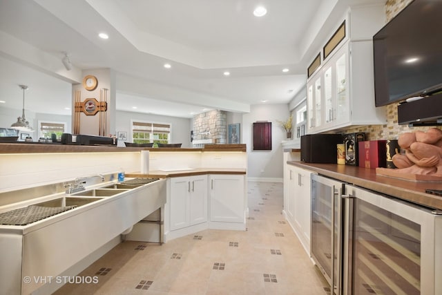 6531 W Cedar Ct, Monee, IL 60449 - kitchen featuring wine cooler, recessed lighting, white cabinetry, tasteful backsplash, and light tile patterned floors