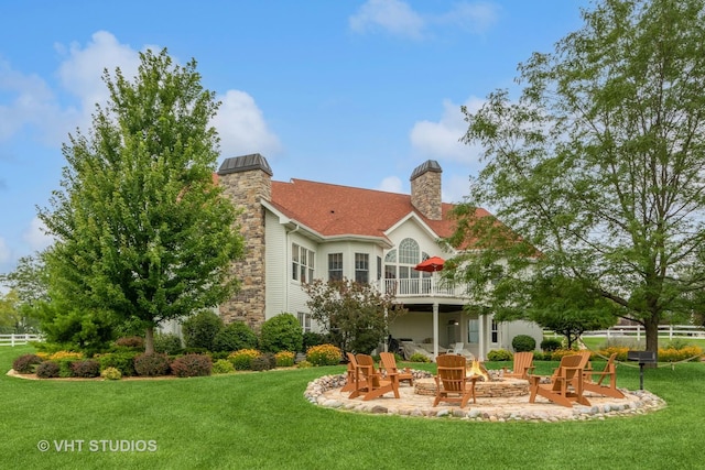 6531 W Cedar Ct, Monee, IL 60449 - back of property with an outdoor fire pit, a chimney, stone siding, and a patio area