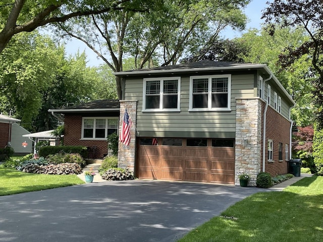 228 S Glendale Ave, Barrington, IL 60010 - view of front facade with a garage, asphalt driveway, stone siding, and a front lawn