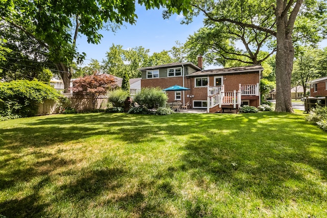228 S Glendale Ave, Barrington, IL 60010 - back of house with a chimney, brick siding, and a wooden deck