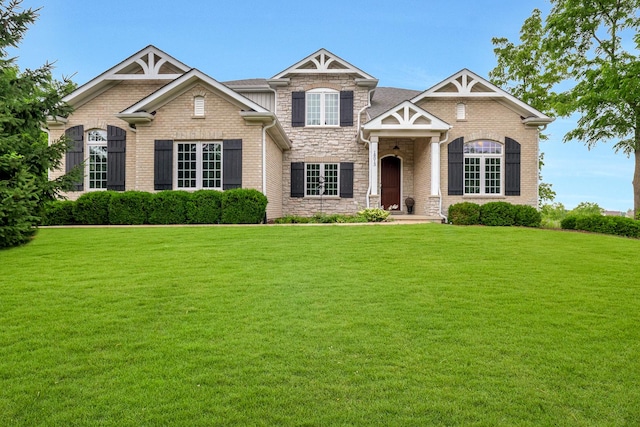 18013 Saint Andrews Dr, Marengo, IL 60152 - craftsman house with a front lawn and stone siding