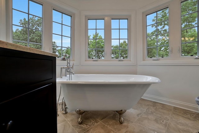 18013 Saint Andrews Dr, Marengo, IL 60152 - full bathroom featuring a freestanding tub and baseboards