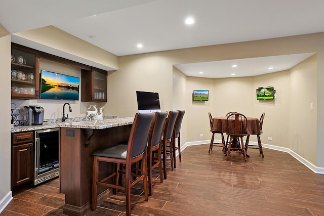 18013 Saint Andrews Dr, Marengo, IL 60152 - indoor wet bar with wine cooler, dark wood finished floors, and recessed lighting