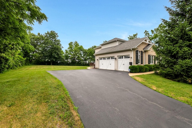 18013 Saint Andrews Dr, Marengo, IL 60152 - view of home's exterior with driveway, a lawn, a garage, and brick siding